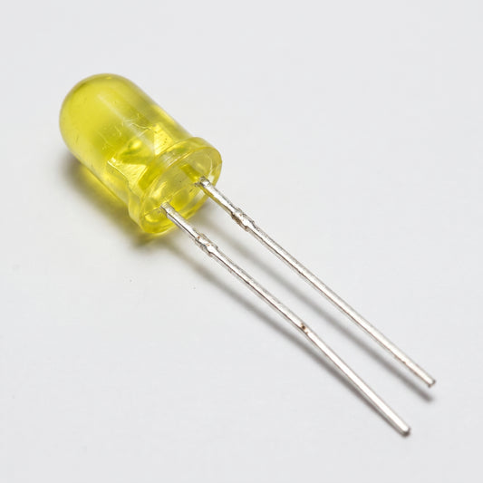 5mm yellow LEDs on workbench showing translucent lens and metal leads