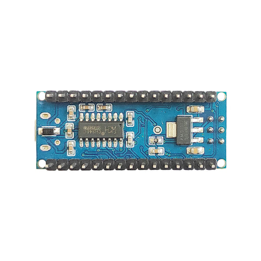 Arduino Nano blue development board lifestyle view on workbench with pin headers visible