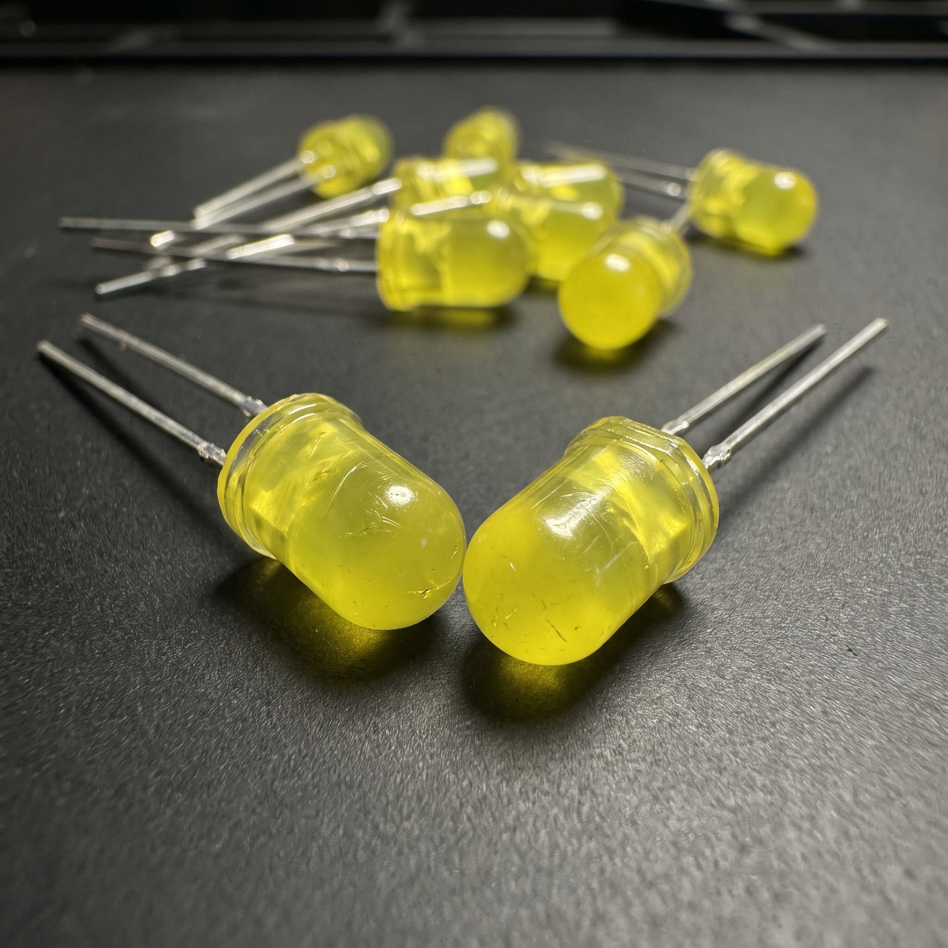 5mm yellow LED close-up showing translucent lens and through-hole leads