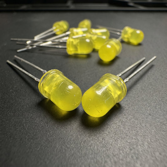 5mm yellow LED close-up showing translucent lens and through-hole leads